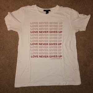 LOVE NEVER GIVES UP T-SHIRT